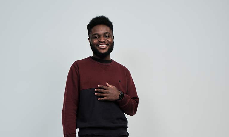 Student Zach Okusi smiling