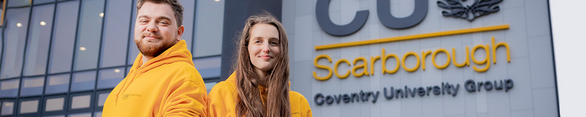 Two students stood outside a Scarborough building