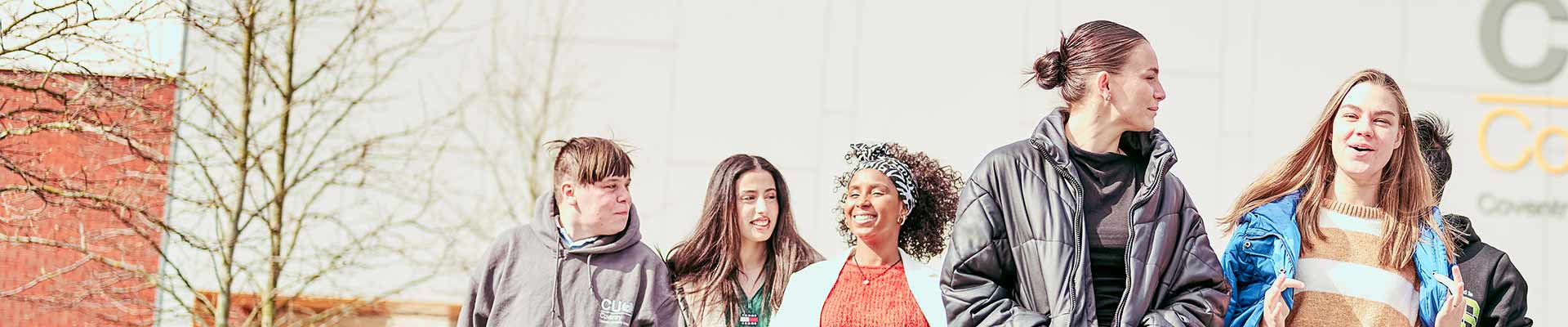 Group of students walking outside the CU Coventry