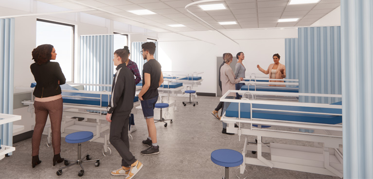 Students in the hospotal ward around a mannequin in a hospital bed