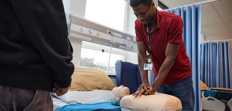 Nursing studenttaking an actor's blood pressure