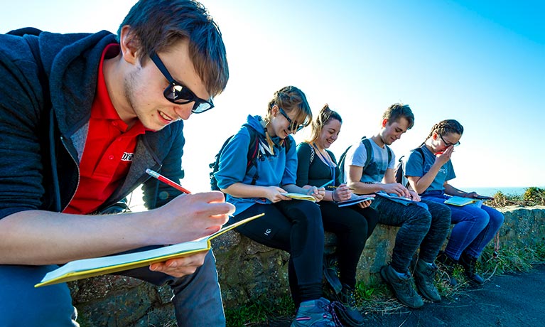 Students working outside.