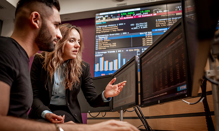 Lecture talking to student in the trading floor