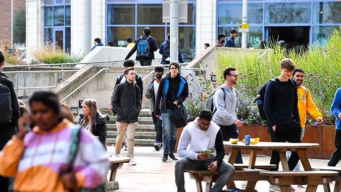 Students walking around the outside of the campus