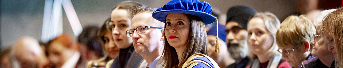 Lady wearing a PhD graduation cap and gown