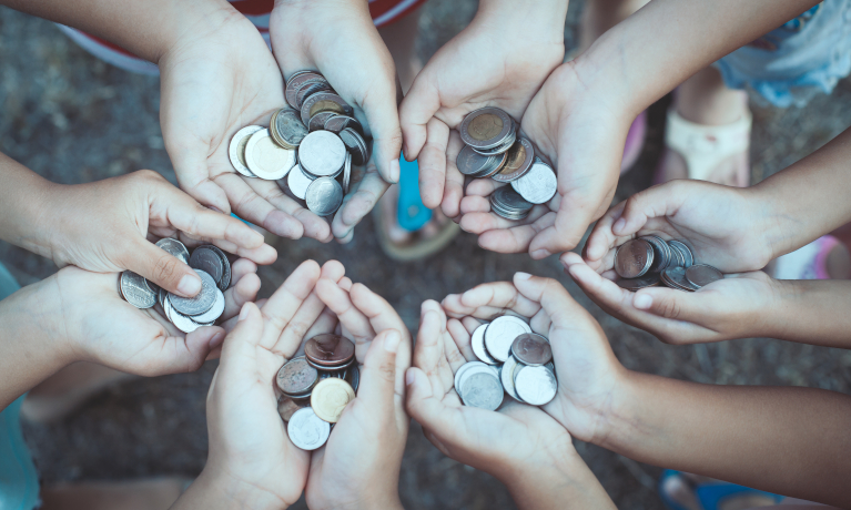 Lots of pairs of hands holding money