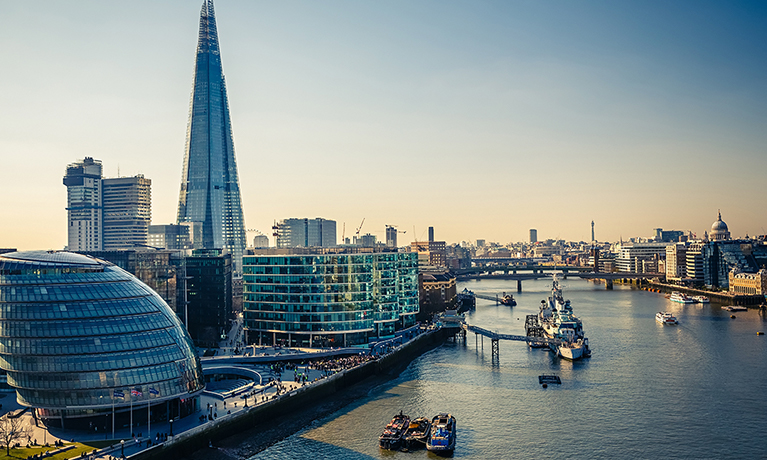 The skyline of London at sunset with the Shard