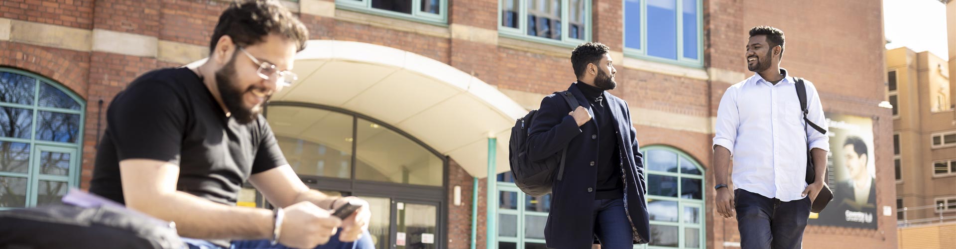 Two students walking on campus