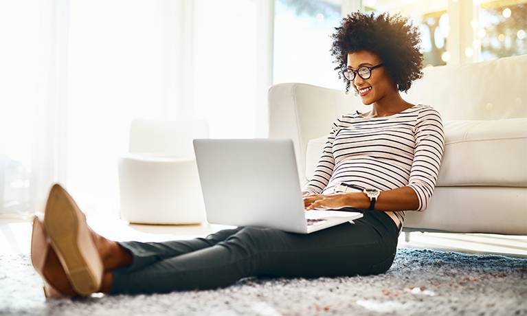 female student working on the laptop