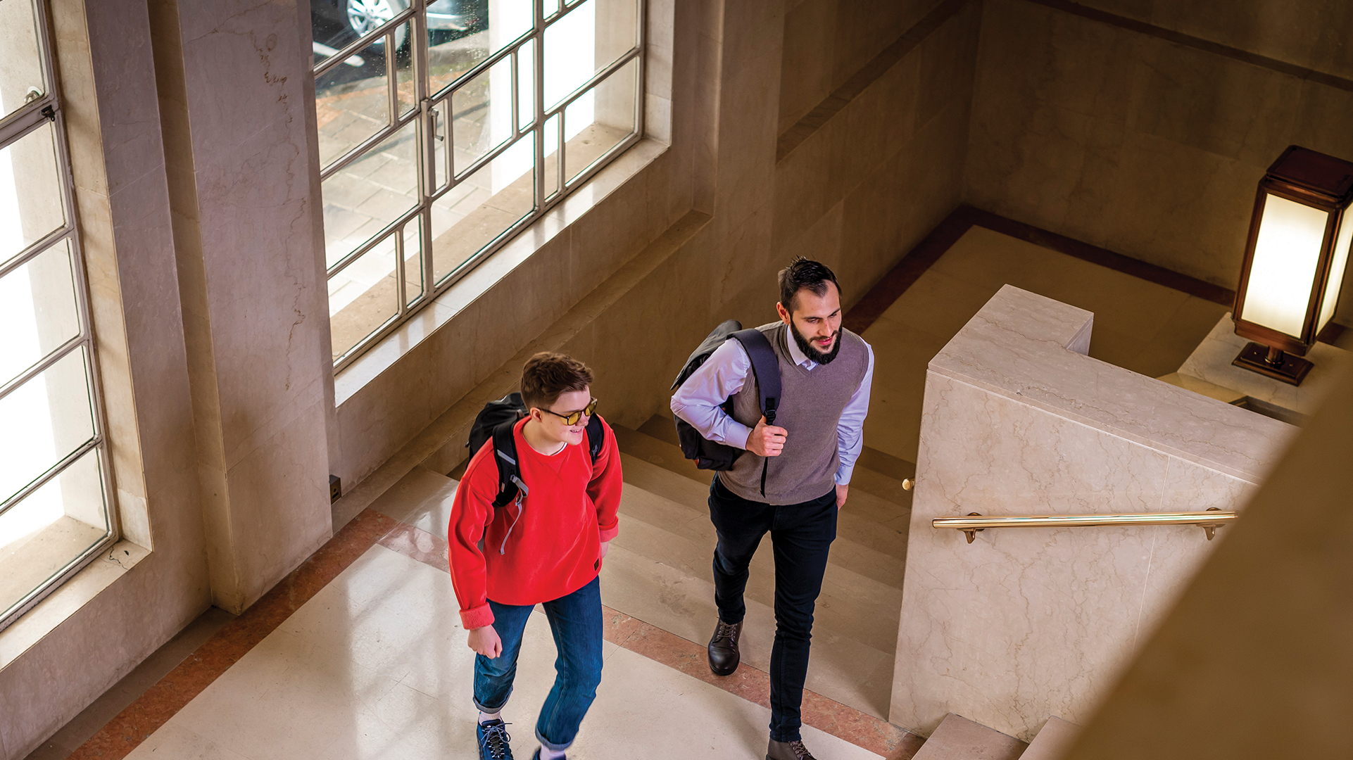 Two Cyber Security students walking through a hall at Dagenham