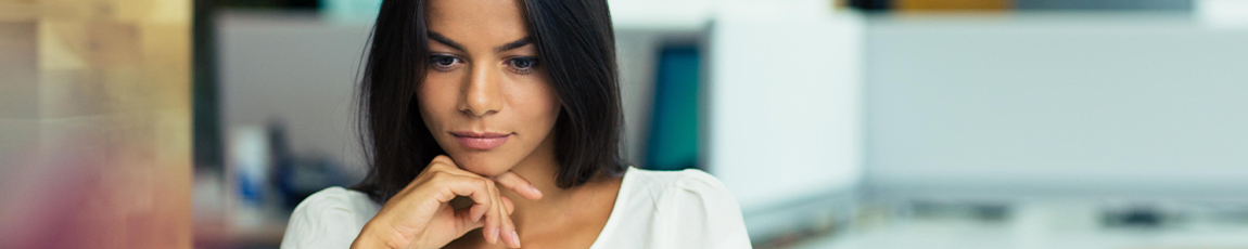 Female student sat at computer looking at computer screen